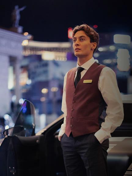 George Russle stants in front of the new Mercedes-AMG GT 4-Door Coupe prototype