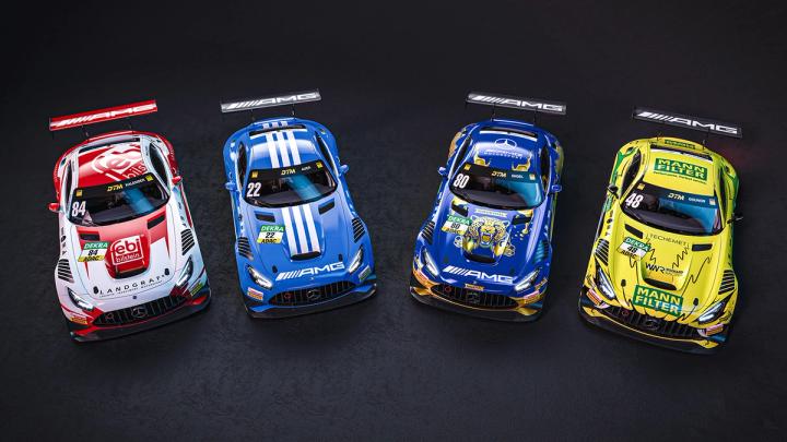 DTM racecars aligned on the racetrack