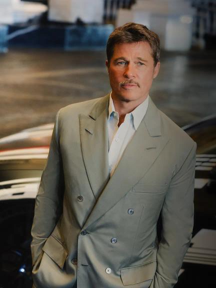Portrait of Brad Pitt in front of the new C590 Mercedes-AMG GT 4-Door Coupe prototype.