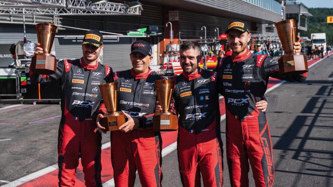 Mercedes-AMG GT racing drivers hold their trophies aloft