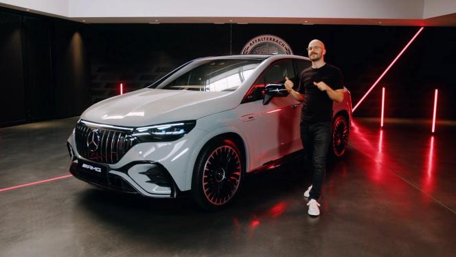 The product manager standing next to aMercedes-AMG EQE 53 SUV 4MATIC+