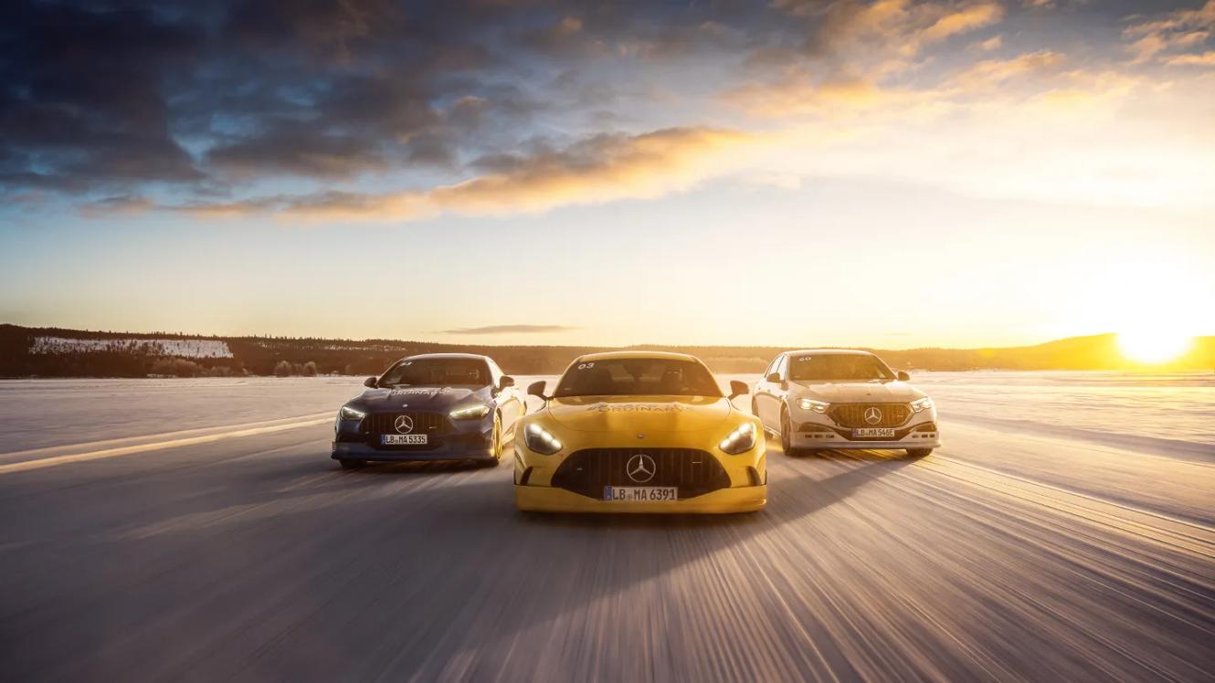 Three Mercedes-AMG vehicles in a winter landscape