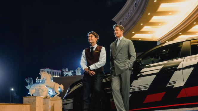 Brad Pitt and George Russell in front of the new Mercedes-AMG GT 4-Door Coupé prototype.