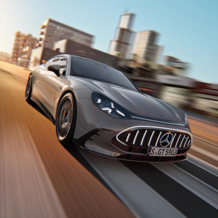 The Mercedes-AMG GT 55 4-Door Coupé driving in an urban setting